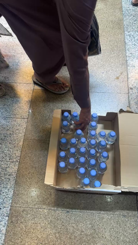 Distribute Water Bottles In Makkah & Madinah